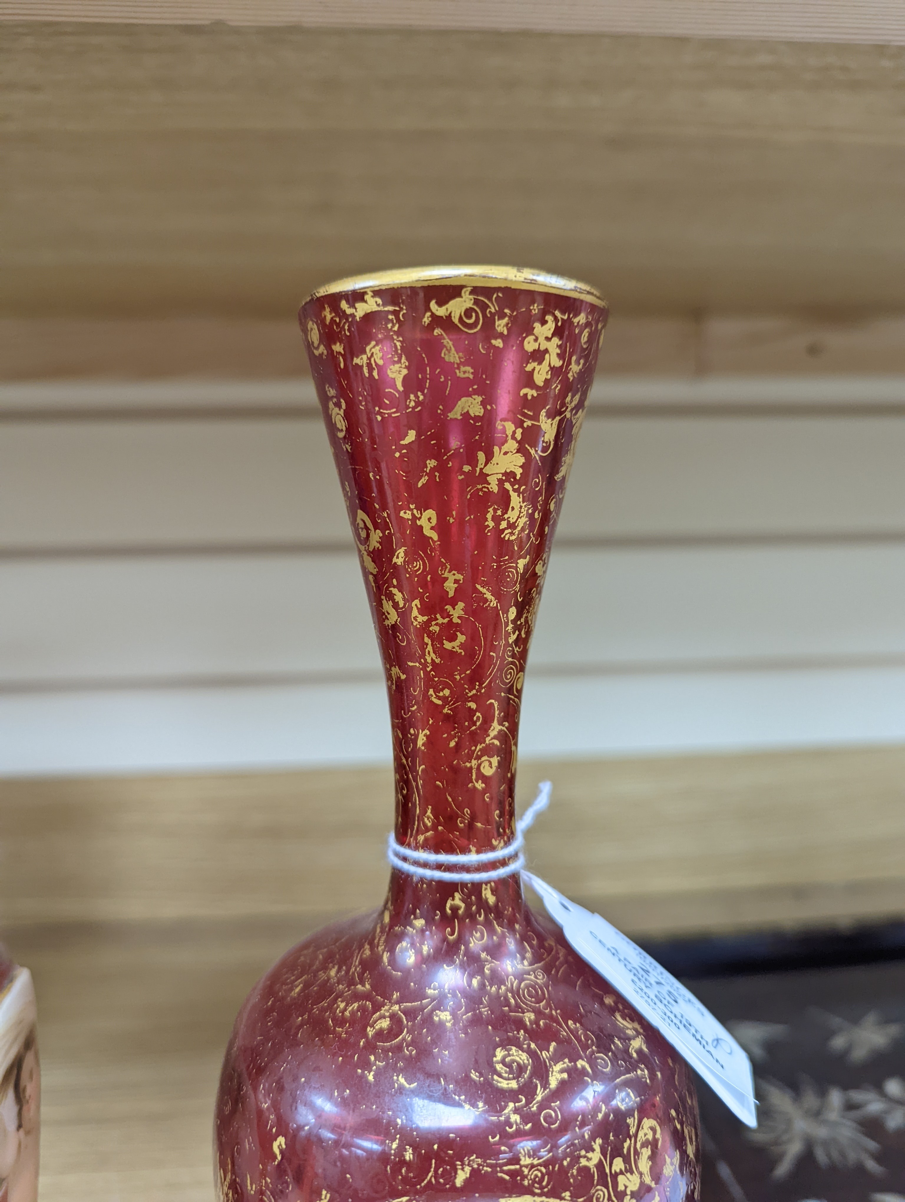 A pair of 19th century Bohemian enamelled and overlaid ruby glass vases 36cm